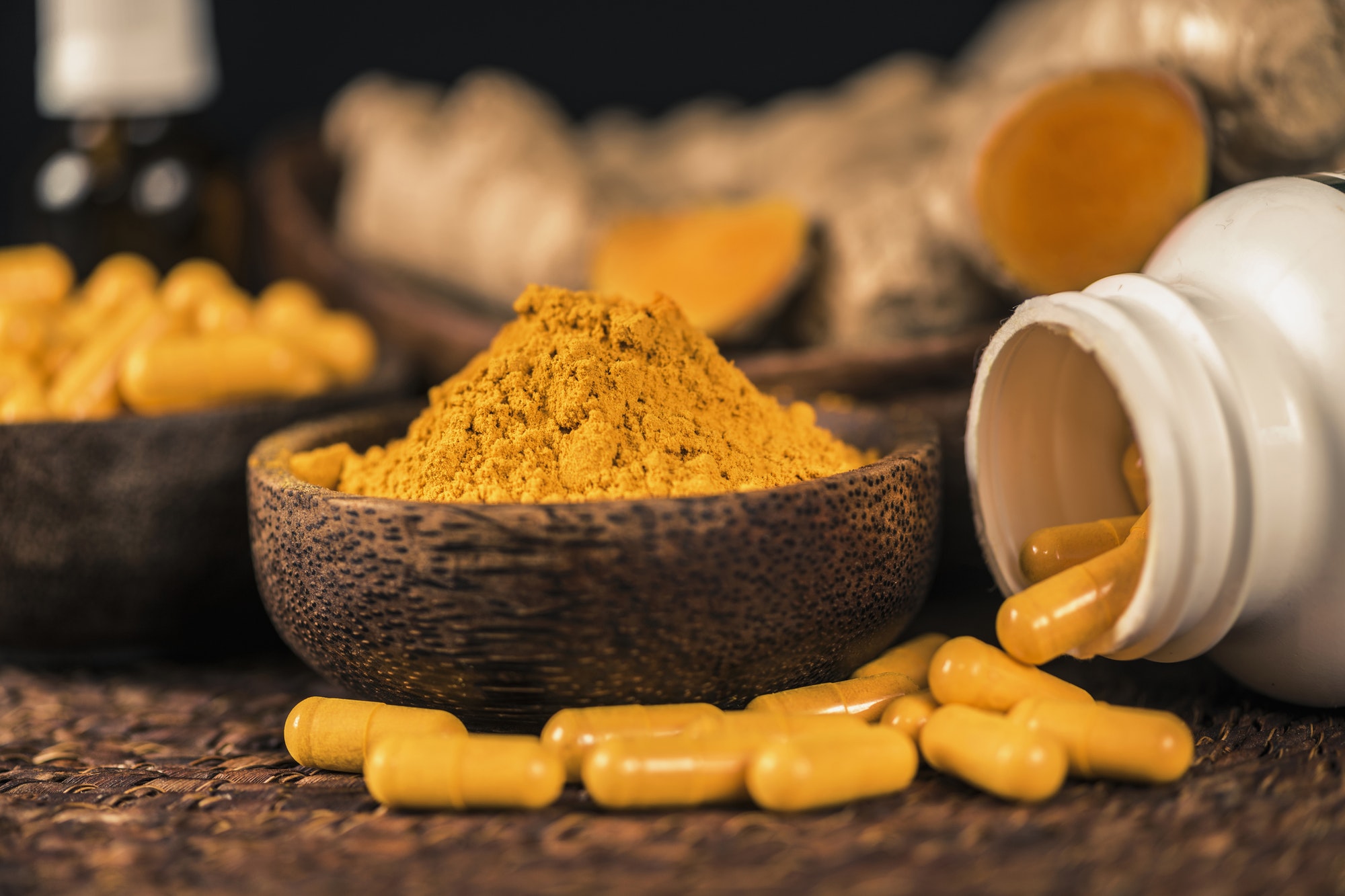 Curcumin Herbal Supplement Capsules and Turmeric Powder