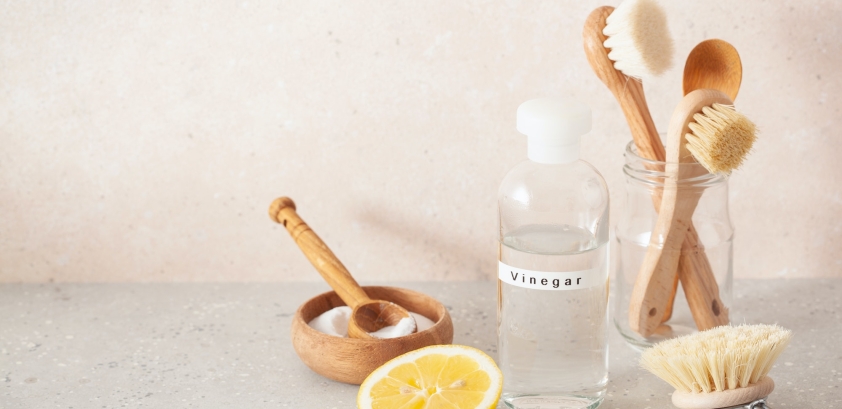 zero waste eco friendly cleaning concept. wooden brushes, lemon, baking soda, vinegar